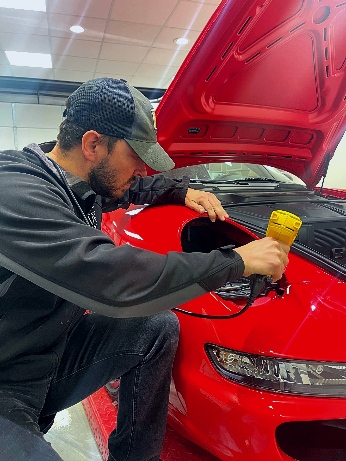 Clear bra installation on Porsche fender.